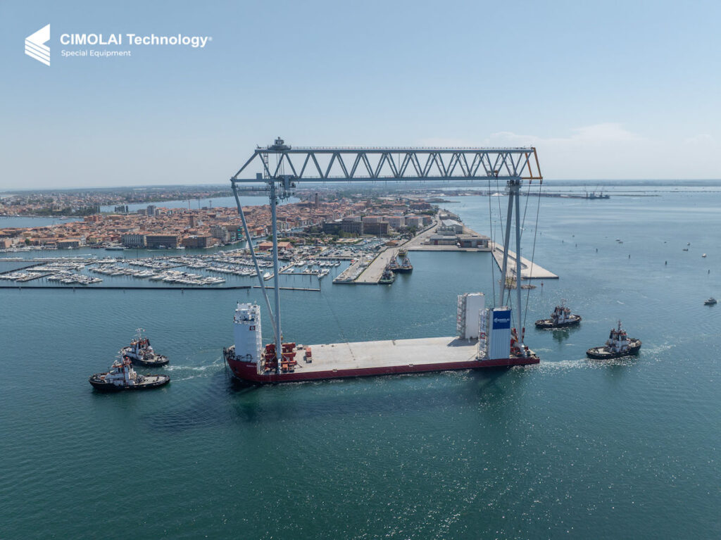 Barge with Goliath crane and four tugs